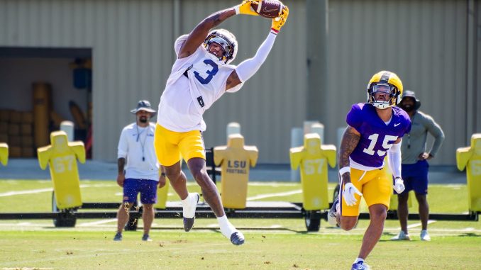 Sage Ryan watches Chris Hilton make a reception during drills on 8-7-2024