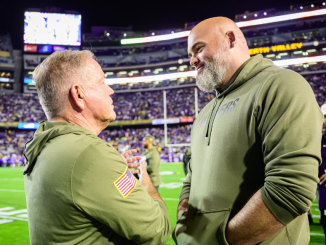 LSU head football coach with Tigers' legend Andrew Whitworth.