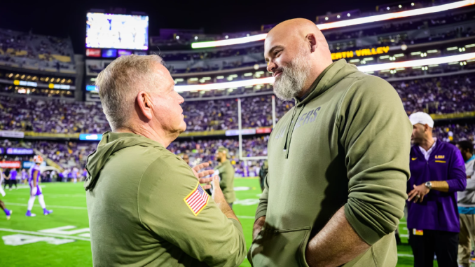 LSU head football coach with Tigers' legend Andrew Whitworth.