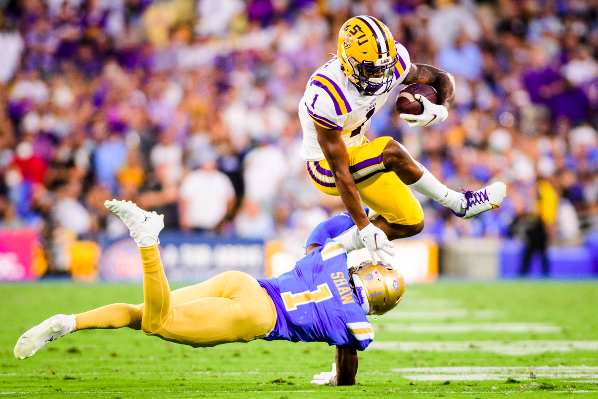 Why does the LSU football team wear white jerseys at home?